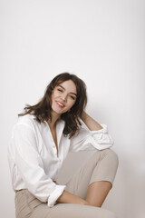 Lady in White Suit On Bright Background