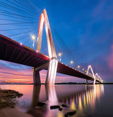 Fototapeta na wymiar The Nhat Tan Bridge is a cable-stayed bridge crossing the Red River in Hanoi,