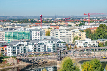Bird view at modern living district at Elbe river side in Magdeburg during golden Autumn at blue sky and sunny day, Magdeburg, Germany.