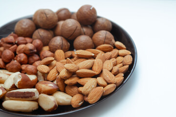 different types useful nuts laid out on a plate 