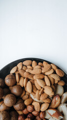 different types useful nuts laid out on a plate 