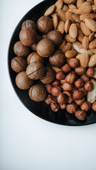 different types useful nuts laid out on a plate 