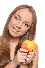 Portrait of beautiful young woman with ripe apple