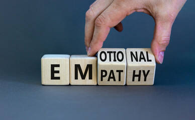 Emotional empathy symbol. Doctor turns wooden cubes and changes the word 'Emotional' to 'Empathy'....