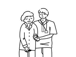 おばあさんを介助する男性介護士