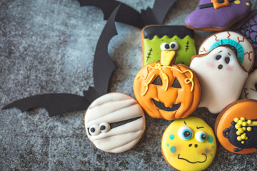 Delicious Halloween ginger biscuits closeup. horizontal top view. Halloween gingerbread biscuits on black background. Taking your Halloween decorations out of the box