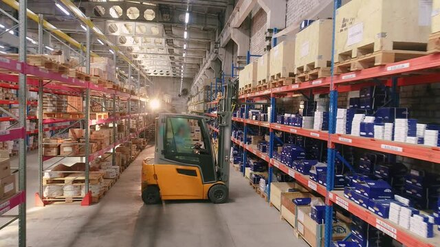 Forklift in the warehouse. Work forklift in a modern warehouse. Industrial interior