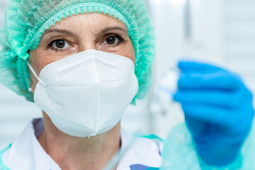 Doctor, woman nurse, scientist hand in white gloves holding bottle, syringe coronavirus, covid-19 vaccine disease preparing for a child, adult, man and woman vaccination shot medicine and drug concept