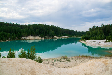 kaolin quarry with turquoise water and white clay