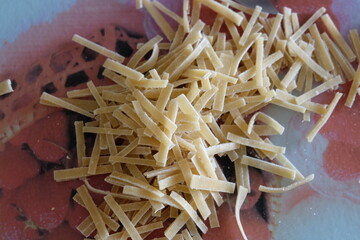 Preparing process of homemade Turkish noodle, selective focus. Noodles are the pasta that Turkish women make. It is called 