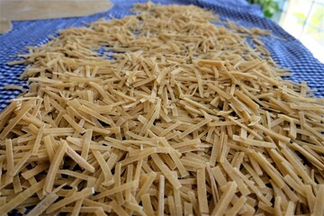 Preparing process of homemade Turkish noodle, selective focus. Noodles are the pasta that Turkish women make. It is called 