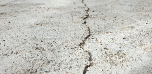 Crack in concrete. Crack in the structure. Crack background. Crack in the road. Split. Earthquake.