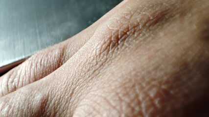 Fototapeta premium human skin texture. Macro healthy and young hand skin