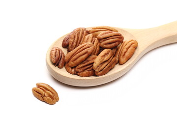 Pecan nut in wooden spoon isolated on white background