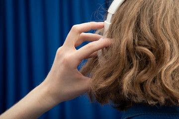 Fototapeta premium White headphones.Headphones for listening to audio files.Wireless headphones.