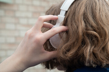 Naklejka premium White headphones.Headphones for listening to audio files.Wireless headphones.