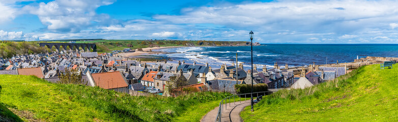 A view leading down to the lower part of the town of  Cullen, Scotland on a summers day