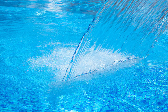 bright blue pool water in daylight © Levachine