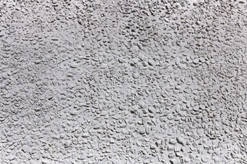 Stone concrete wall of gray color, the background, close up