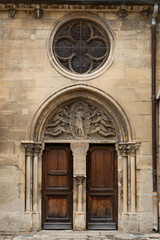 Fototapeta na wymiar Door Church of Notre Dame de Auvers-sur-Oise, site of a painting by Vincent Van Gogh