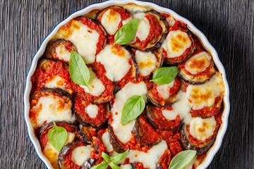 eggplant parmigiana in a baking dish, top view