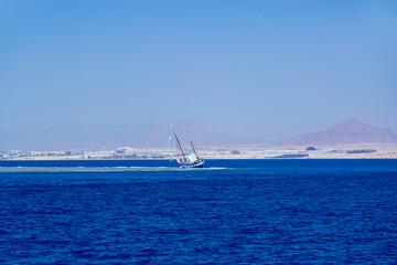Sailboat on a reef in the red Sea