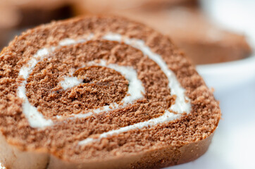 Chocolate sponge roll with a vanilla flavour filling, chocolate swiss roll
