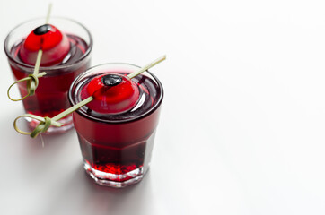 Scary drinks shots made with tequila, grenadine and tabasco decorated with jelly eyeball