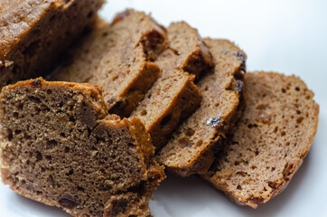 Freshly made spiced fruit  loaf cake  on the white  background