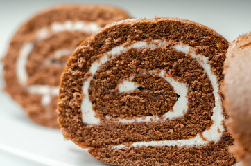 Chocolate sponge roll with a vanilla flavour filling, chocolate swiss roll