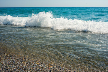 sea ​​wave with white foam in the mediterranean sea