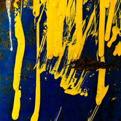 background with paint. metallic surface with yellow paint drips
