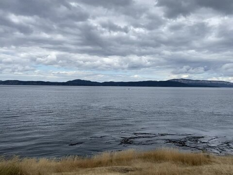 View of  dramatic clouds over Haro Strait and Canadian Gulf Islands from Stuart Island Lighthouse.