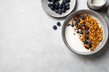 Oatmeal Granola with blueberry. Dry Breakfast. Healthy food or diet concept. Copy space. Granola with greek yogurt. Berry granola with almond. Top view. Food flatlay