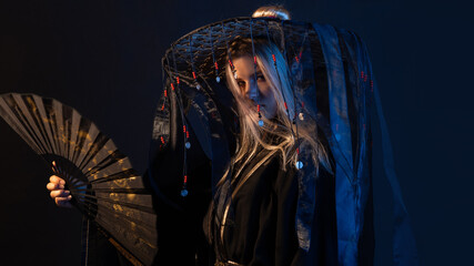 An Asian-style character in a kimono and a straw hat with ribbons