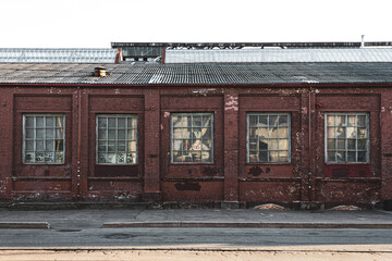 Five windows of an old factory on Oktyabrskaya street