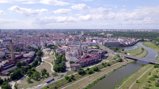 Poznan, Polish city during the day. The sun, the old town, the streets of Poznań, the Warta River and bridges over the river.