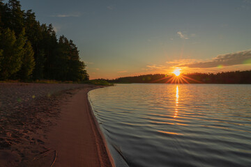 Early sunrise at sea. Reflected sun rays on sea water. Glare on the water Natural sea water...