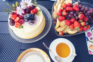 Festive table, served. Cake and tea utensils Congratulation concept. Birthday