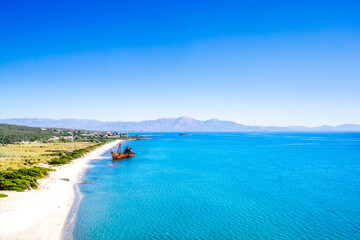 Obraz premium Rusty and abandoned shipwreck on a coastline near Gythio in Lakonia, Peloponnese Greece