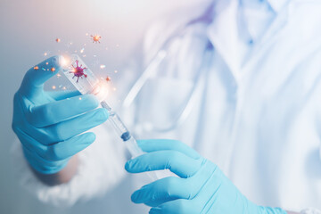 A doctor or scientist in a vaccine research and development lab analyzes antibody samples for medical patients to protect against COVID-19. The mutant carried a syringe containing the liquid vaccine.