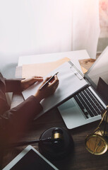 Business and lawyers discussing contract papers with brass scale on desk in office. Law, legal...