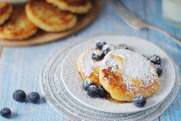 Cottage cheese pancakes - traditional Russian syrniki	