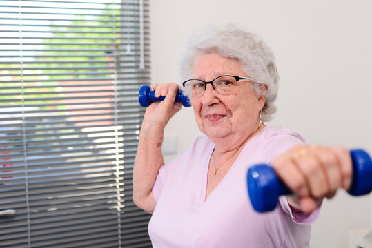 portrait of an active and dynamic senior woman doing sport fitness at home