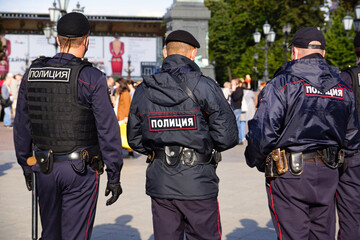 Moscow, Russia - August 29, 2020. Three police officers on duty. Moscow police officers patrol the city streets
