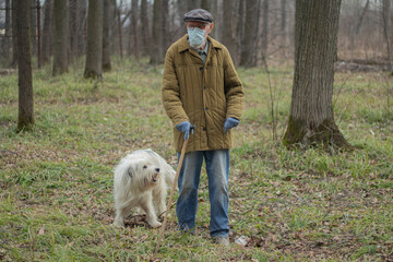 An old man in Russia. A man with a walking stick.