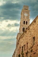 The clock tower of Khan al-Umdan at the old city of Acre, Israel.