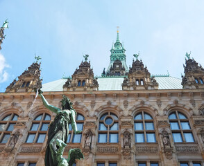Fototapeta premium Historic city hall in the city of Hamburg with blue sky