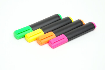 Multicolored markers on white background