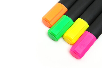 Multicolored markers on white background